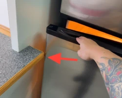 Refrigerator installed hard against a side wall preventing its door from opening fully