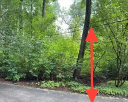 Service Conductors – Low Clearance Over the Driveway Overhead electrical service conductors hanging low across a residential driveway