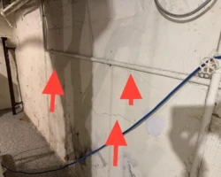 Horizontal crack running along the parged surface of a foundation wall